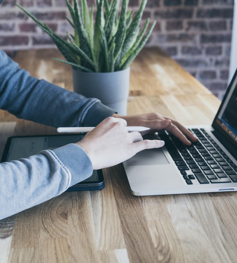 MacBook and IT equipment set up in a startup workspace